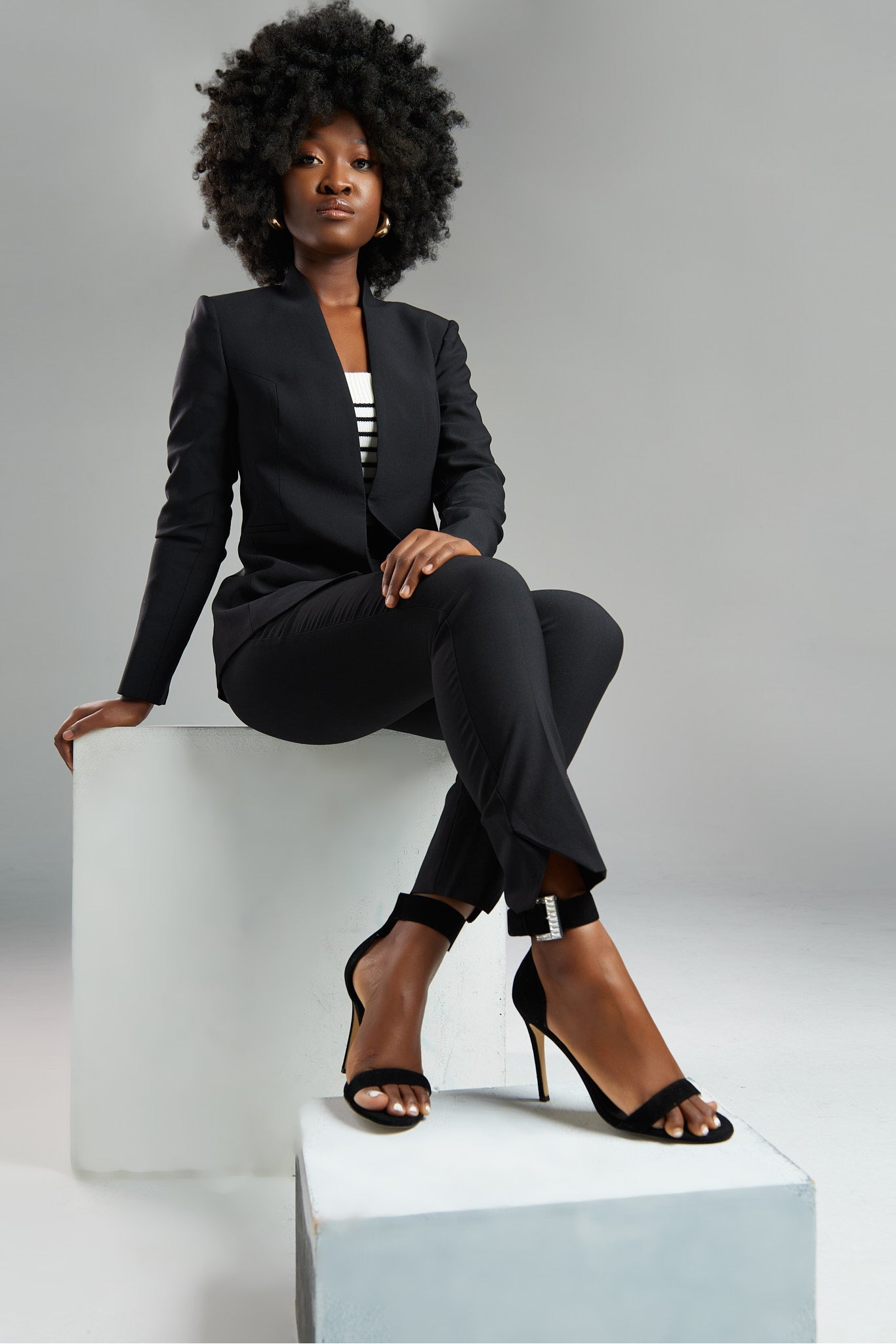 Seragyi's Nicole Blazer in Women's Suits, made from Italian Merino Wool. Features a cross-over collar and pyramid-cut sleeves, blending elegance and comfort in Women's Clothing.