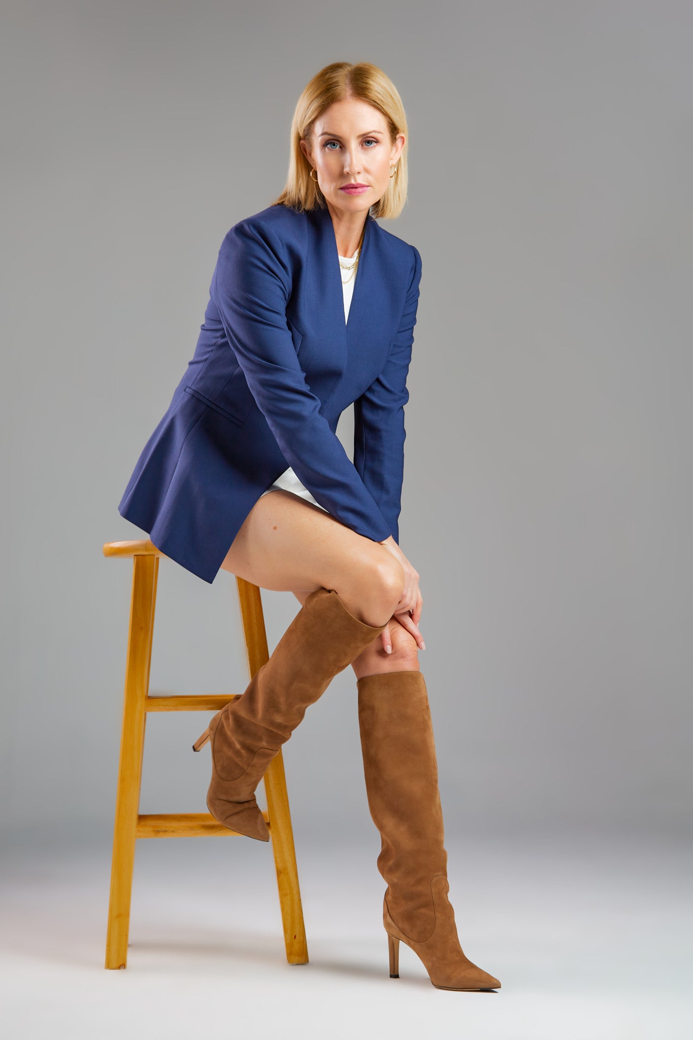 Seragyi's Nicole Blazer in Women's Suits, made from Italian Merino Wool. Features a cross-over collar and pyramid-cut sleeves, blending elegance and comfort in Women's Clothing.
