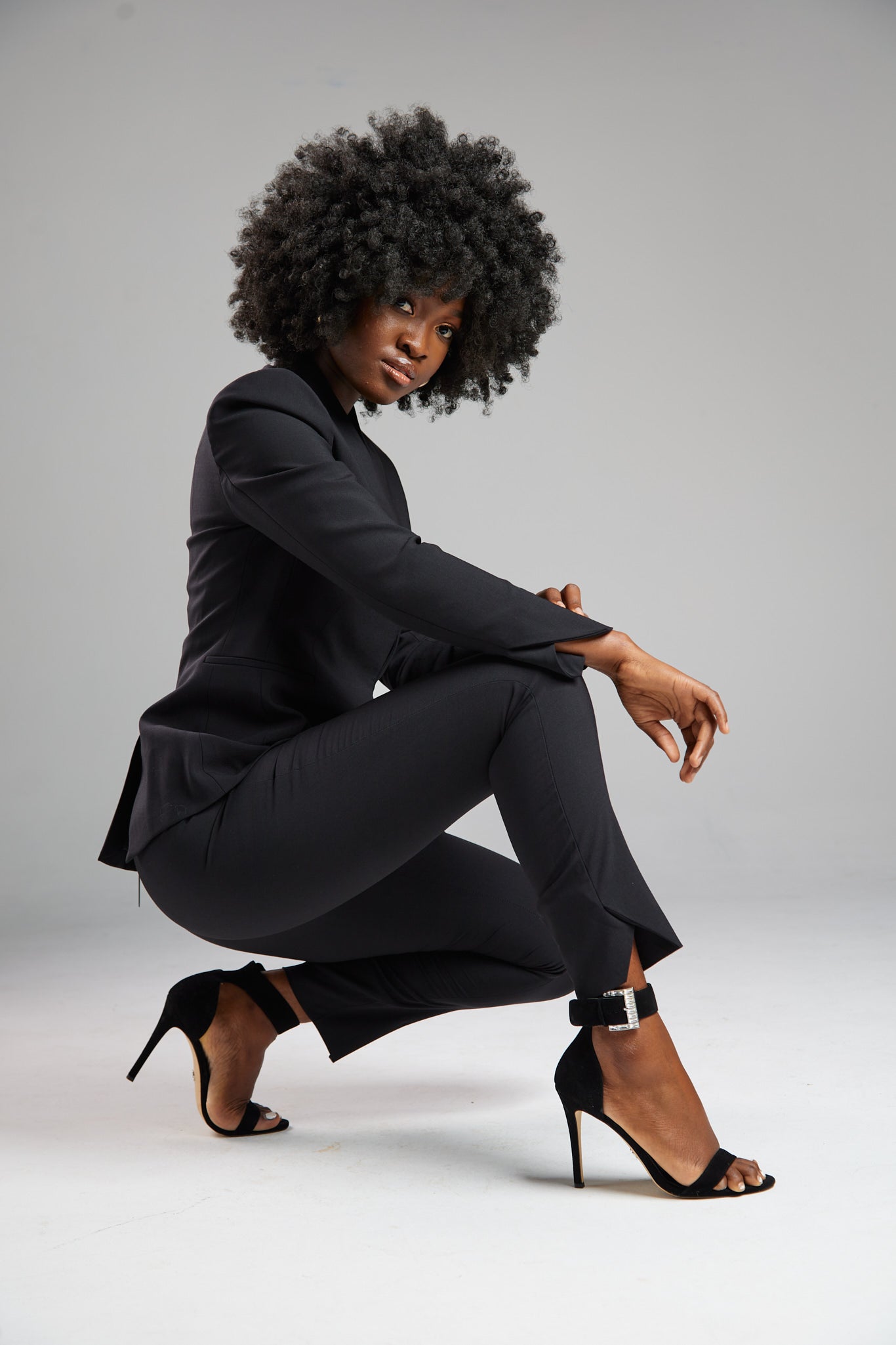 Seragyi's Nicole Blazer in Women's Suits, made from Italian Merino Wool. Features a cross-over collar and pyramid-cut sleeves, blending elegance and comfort in Women's Clothing.