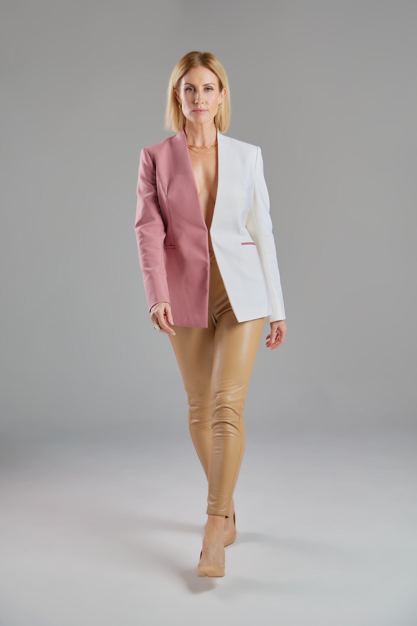 Seragyi's Nicole Blazer in Women's Suits, made from Italian Merino Wool. Features a cross-over collar and pyramid-cut sleeves, blending elegance and comfort in Women's Clothing.