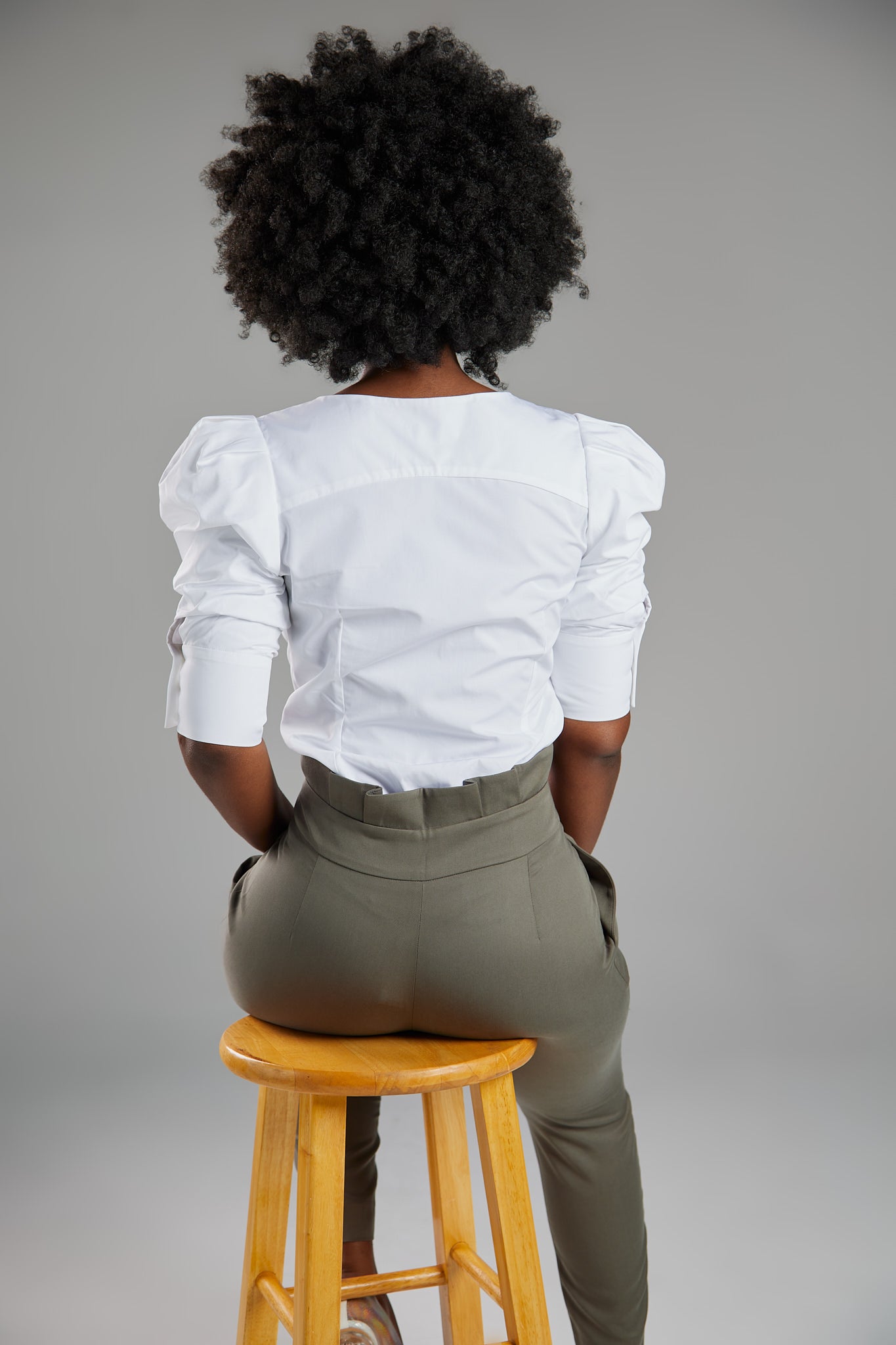 Seragyi's Martina Blouse in White, crafted from 100% eco-friendly cotton. Featuring an asymmetrical neckline and ruched sleeves, it's a versatile and elegant piece in Women's Clothing.