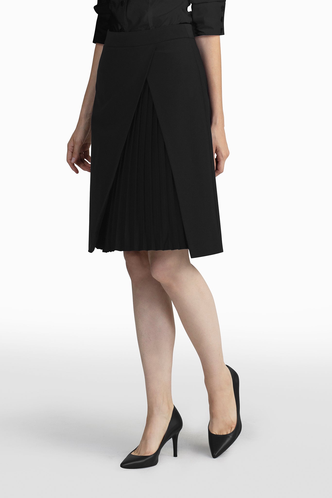 Seragyi's Mai Skirt, an elegant pleated design crafted from ethically sourced Italian Merino Wool and elastane. A blend of style, comfort, and sustainability in Women's Clothing, perfect for pairing with blouses or cowls.