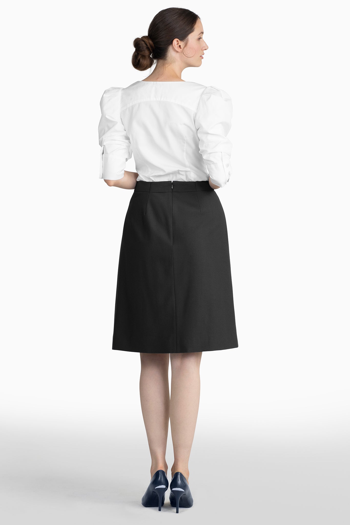 Seragyi's Mai Skirt, an elegant pleated design crafted from ethically sourced Italian Merino Wool and elastane. A blend of style, comfort, and sustainability in Women's Clothing, perfect for pairing with blouses or cowls.
