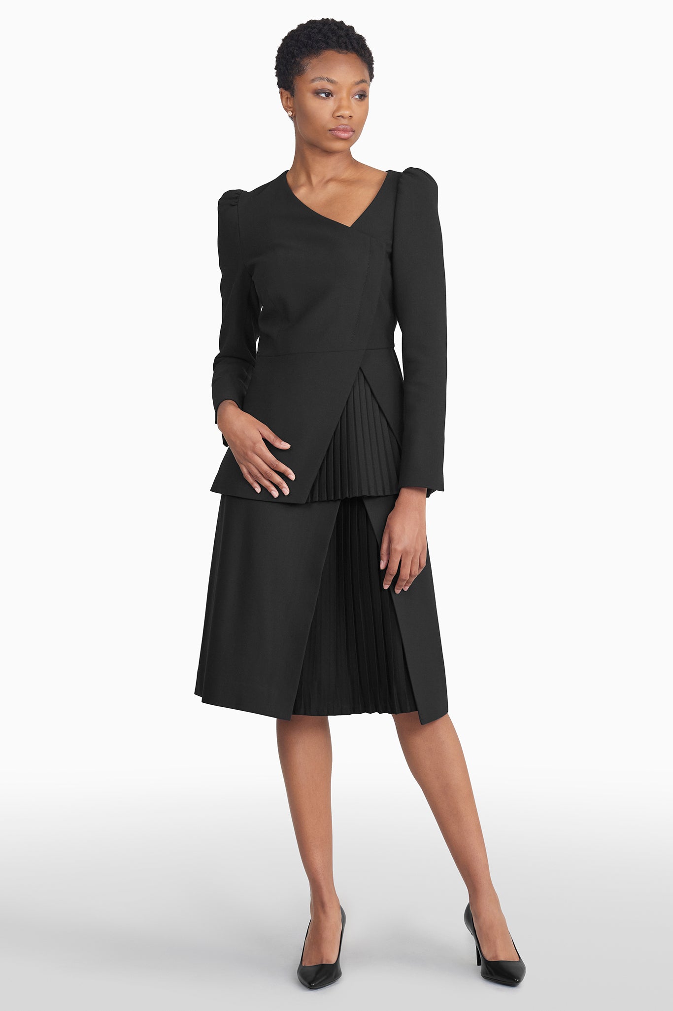 Seragyi's Mai Skirt, an elegant pleated design crafted from ethically sourced Italian Merino Wool and elastane. A blend of style, comfort, and sustainability in Women's Clothing, perfect for pairing with blouses or cowls.