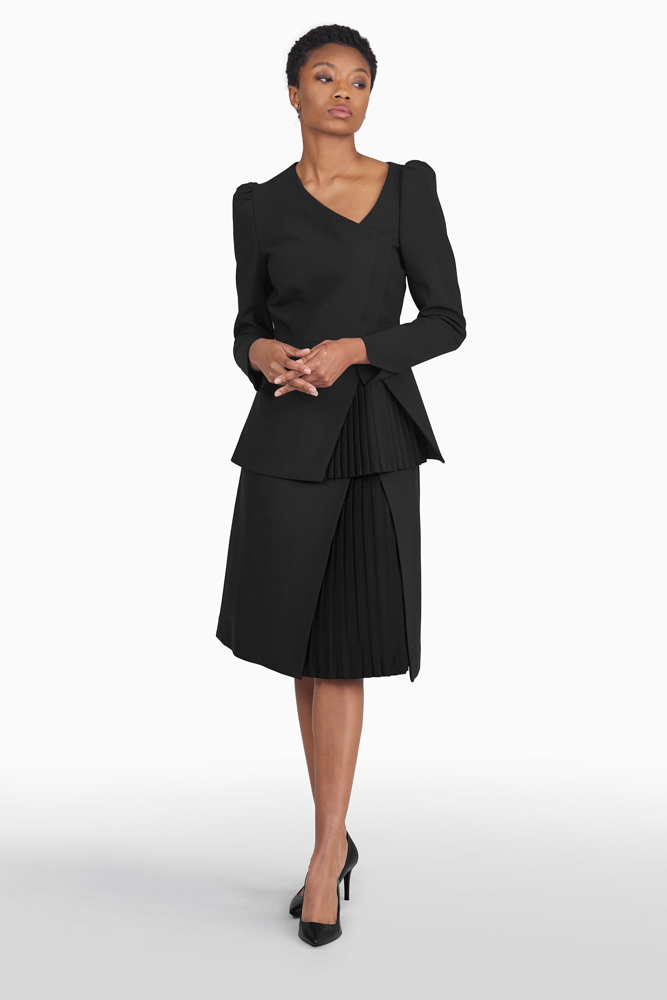 Seragyi's Mai Skirt, an elegant pleated design crafted from ethically sourced Italian Merino Wool and elastane. A blend of style, comfort, and sustainability in Women's Clothing, perfect for pairing with blouses or cowls.
