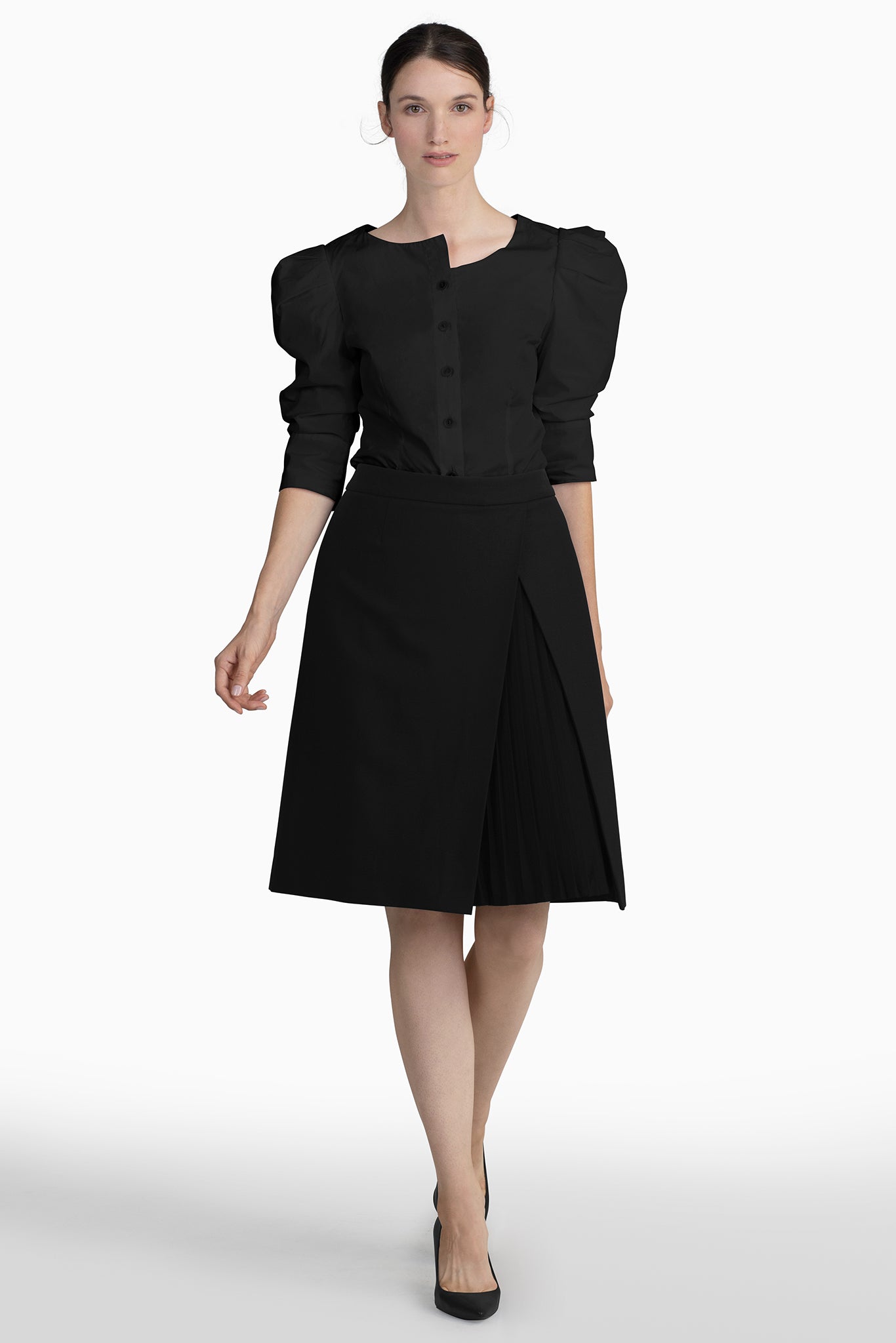 Seragyi's Mai Skirt, an elegant pleated design crafted from ethically sourced Italian Merino Wool and elastane. A blend of style, comfort, and sustainability in Women's Clothing, perfect for pairing with blouses or cowls.