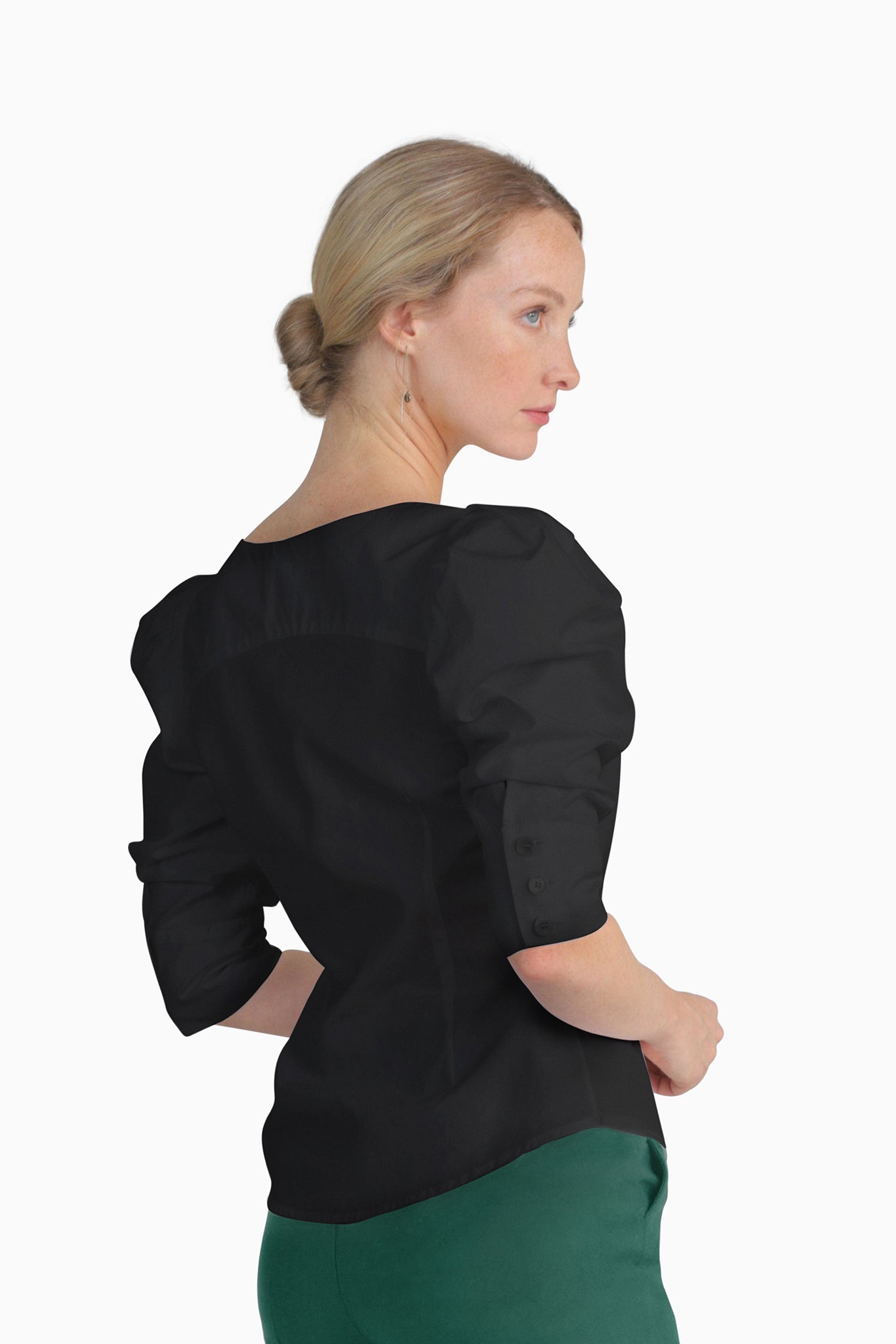 Seragyi's Martina Blouse in Black, made from sustainable cotton. With a modern asymmetrical neckline and ruched sleeves, this elegant design is a must-have in Women's Clothing.