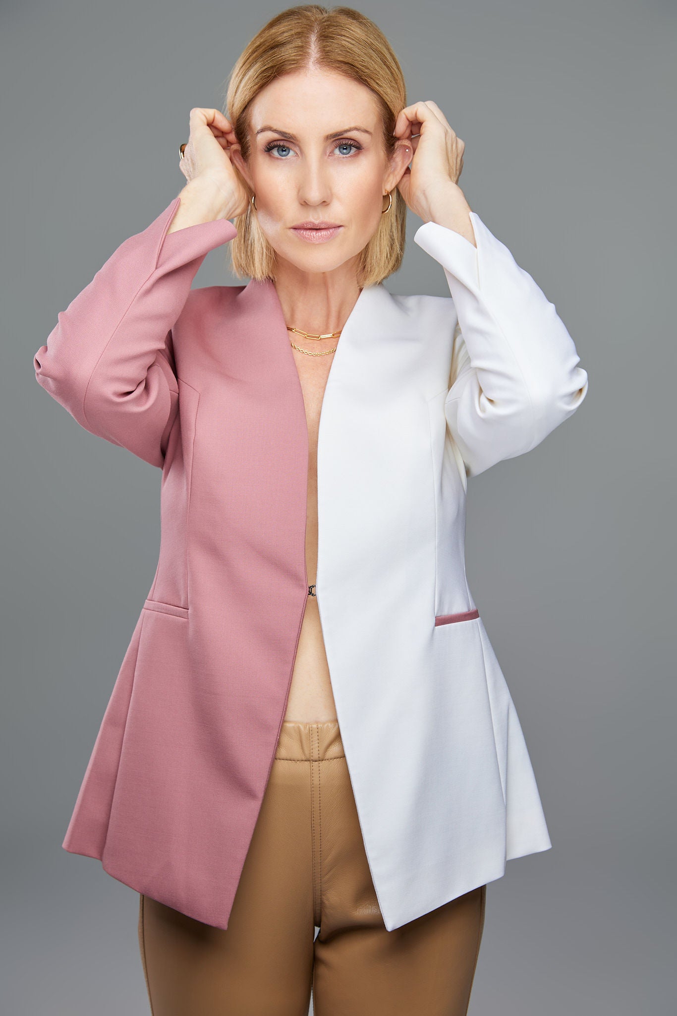 Seragyi's Nicole Blazer in Women's Suits, made from Italian Merino Wool. Features a cross-over collar and pyramid-cut sleeves, blending elegance and comfort in Women's Clothing.
