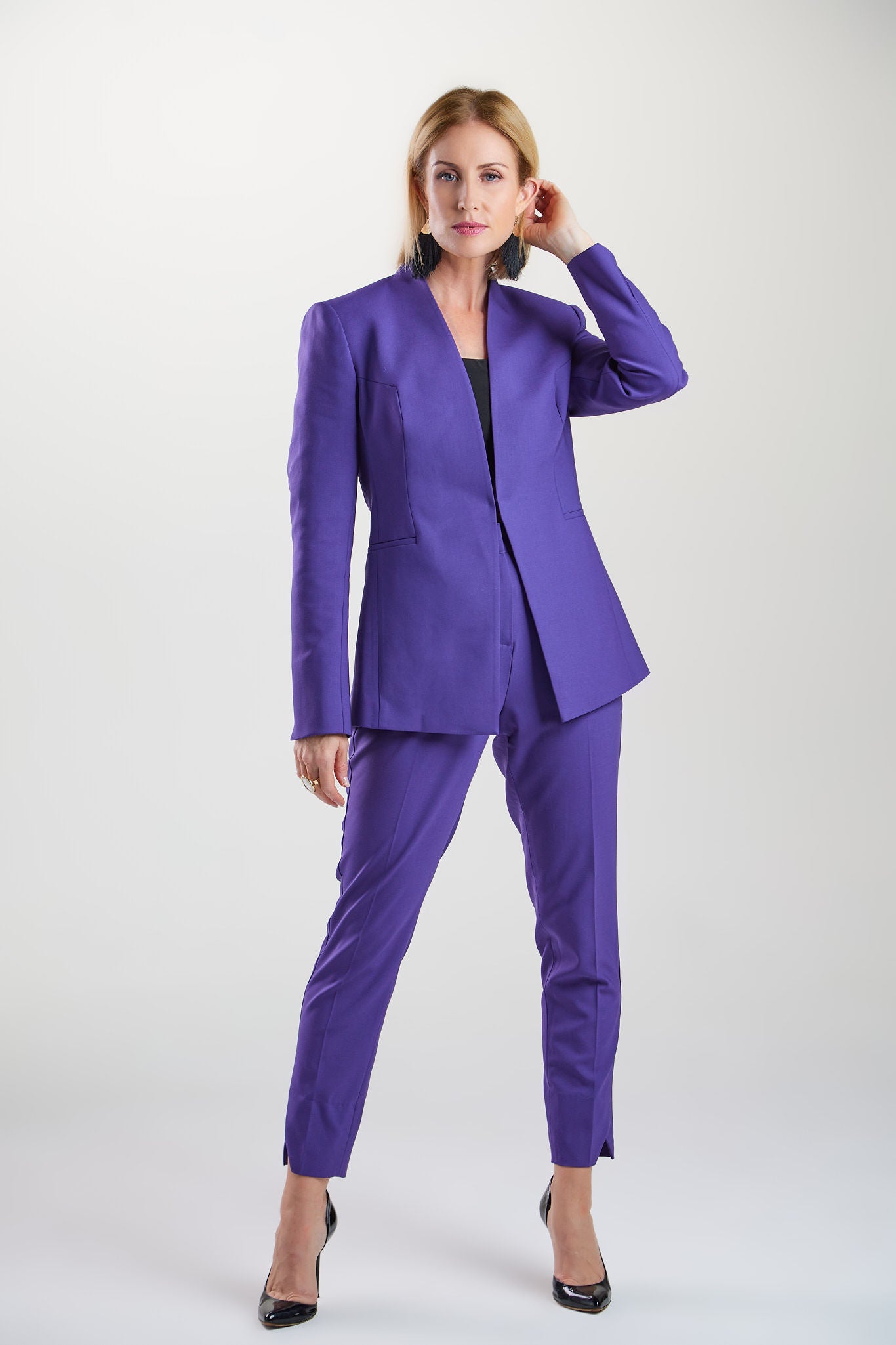 Seragyi's Nicole Blazer in Women's Suits, made from Italian Merino Wool. Features a cross-over collar and pyramid-cut sleeves, blending elegance and comfort in Women's Clothing.