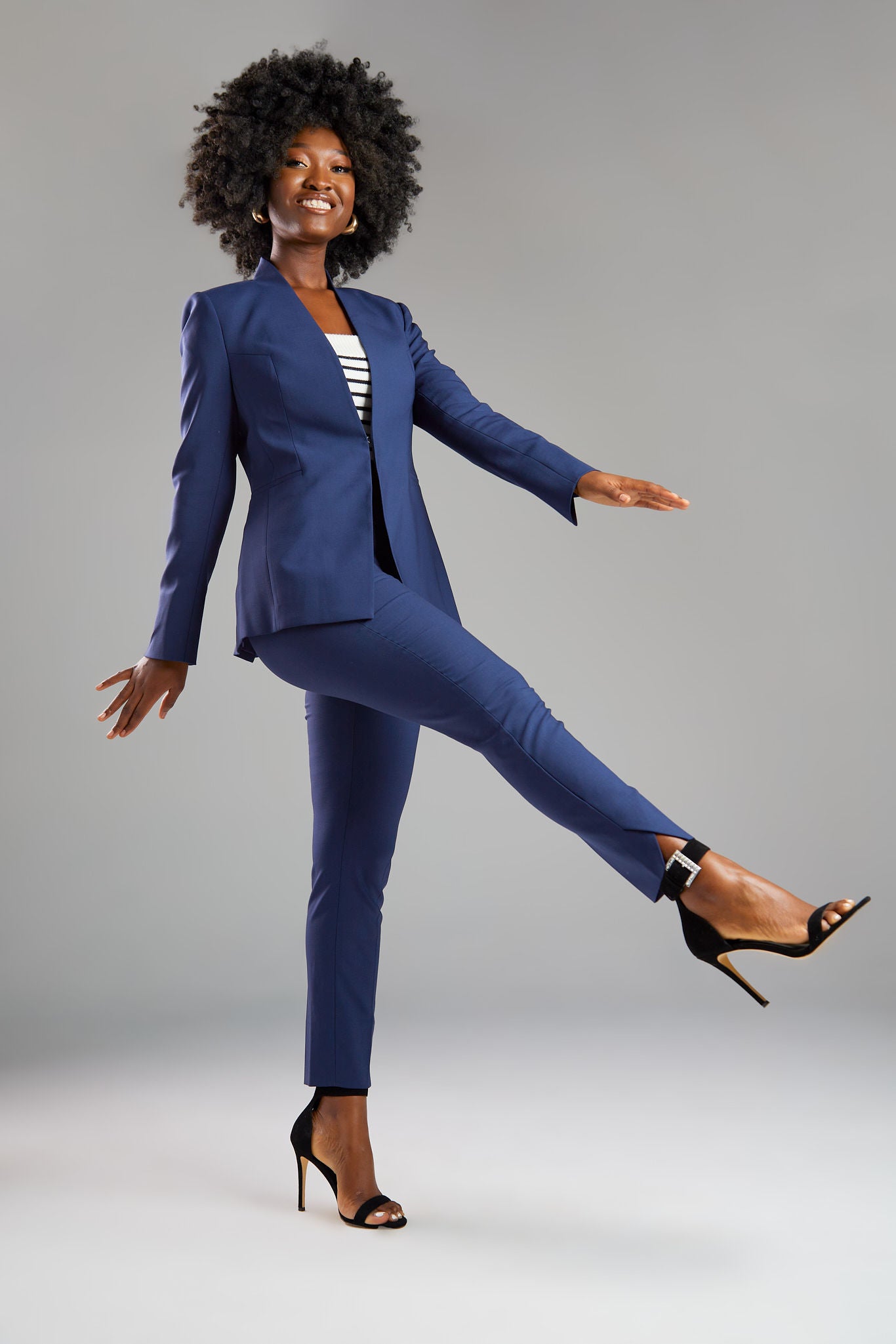 Seragyi's Nicole Blazer in Women's Suits, made from Italian Merino Wool. Features a cross-over collar and pyramid-cut sleeves, blending elegance and comfort in Women's Clothing.