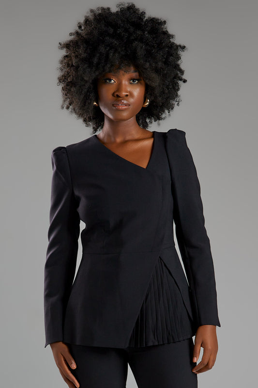 Seragyi's Liz Peplum Jacket in Women's Clothing line, made of wrinkle-resistant Italian Merino wool, showcasing Women's Jackets' sophistication, quality, and sustainability. A prime example of Women's Suits, it features an asymmetrical neckline, pyramid-cut sleeves, and a partially pleated peplum. Ideal for travel and versatile styling, from monochrome looks to skinny jeans and heels for evening wear.