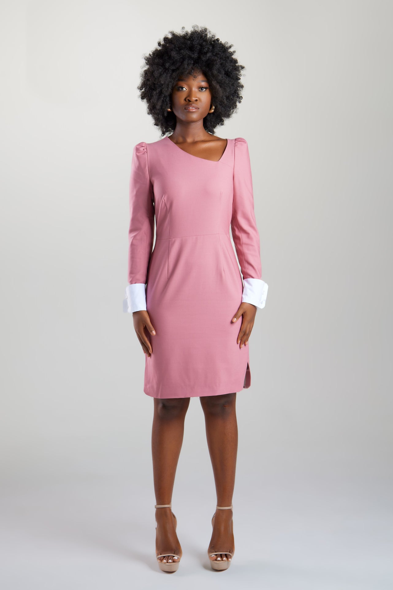 Perfect modern women's dress in Italian extra fine merino wool with asymmetric neckline, puff shoulders, and definitive cuff sleeve details