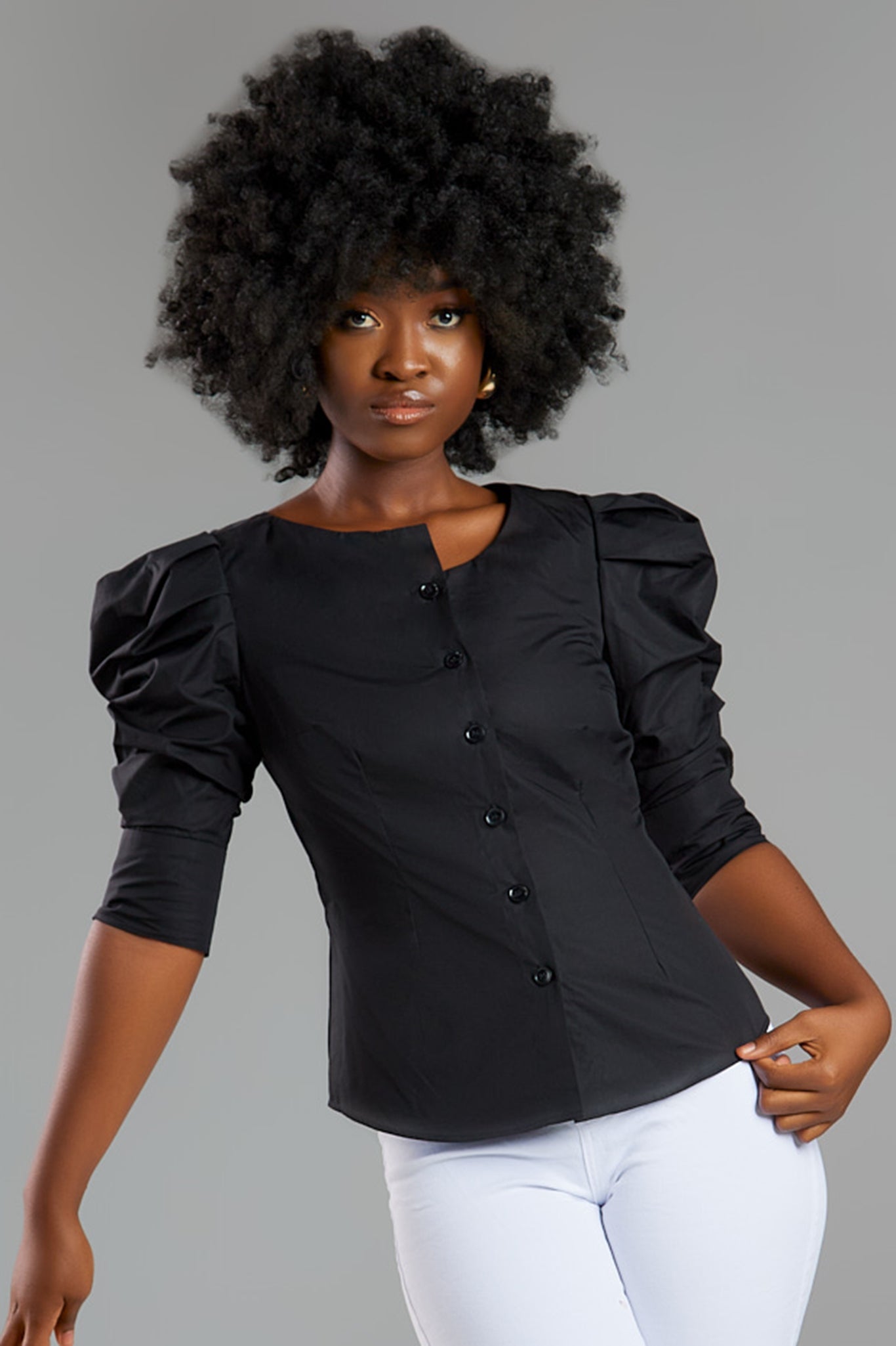 Seragyi's Martina Blouse in Black, made from sustainable cotton. With a modern asymmetrical neckline and ruched sleeves, this elegant design is a must-have in Women's Clothing.