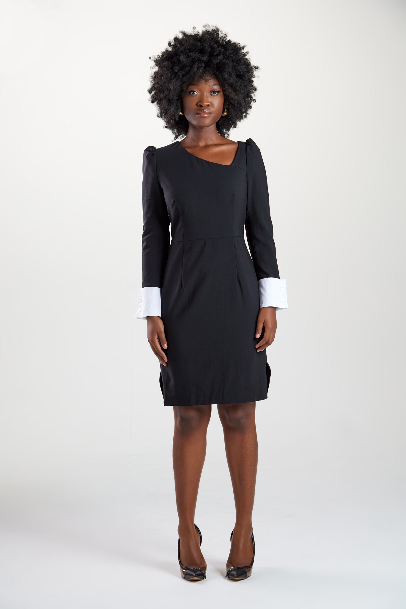 Perfect modern women's dress in Italian extra fine merino wool with asymmetric neckline, puff shoulders, and definitive cuff sleeve details