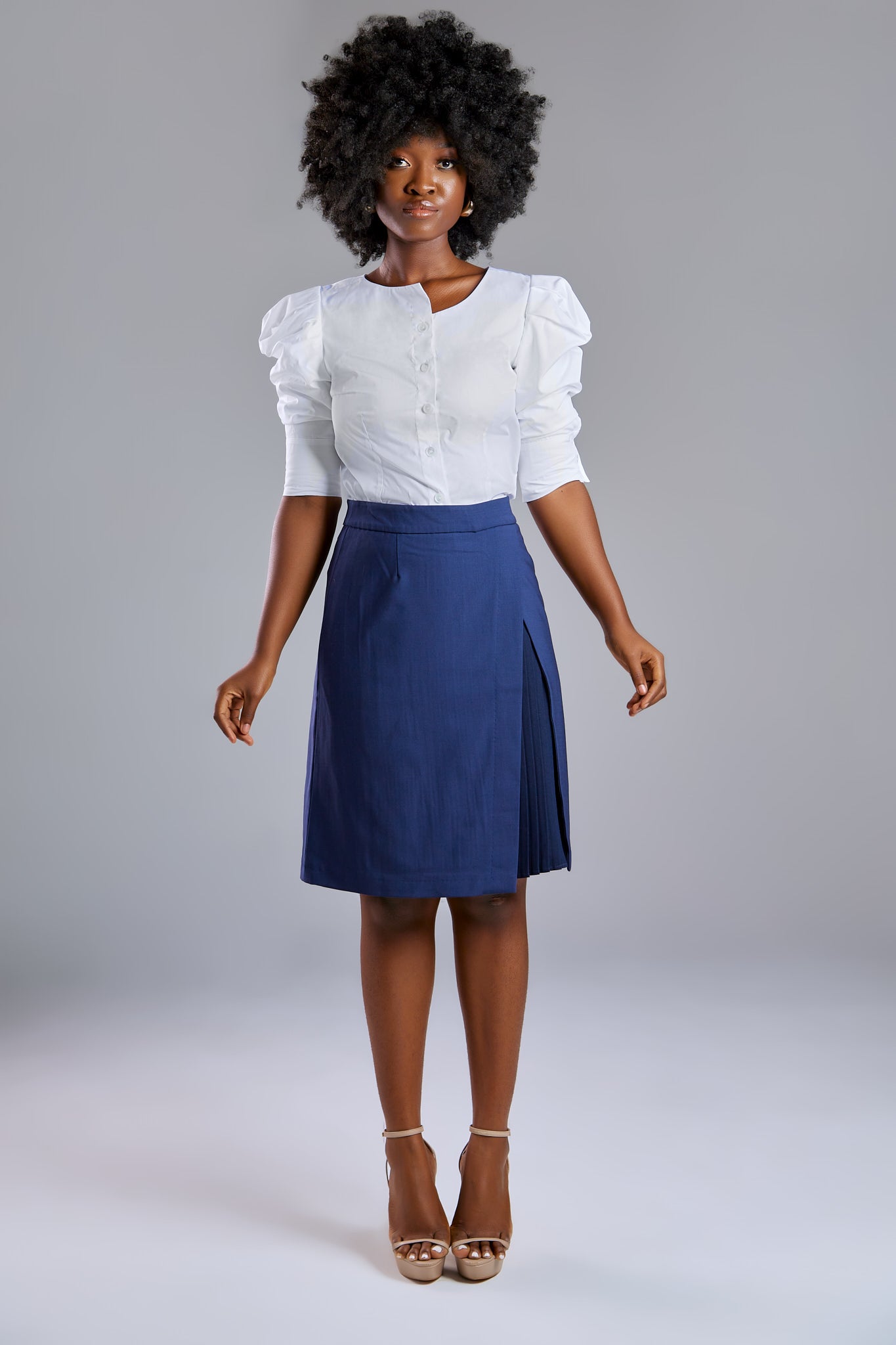 Seragyi's Mai Skirt, an elegant pleated design crafted from ethically sourced Italian Merino Wool and elastane. A blend of style, comfort, and sustainability in Women's Clothing, perfect for pairing with blouses or cowls. 