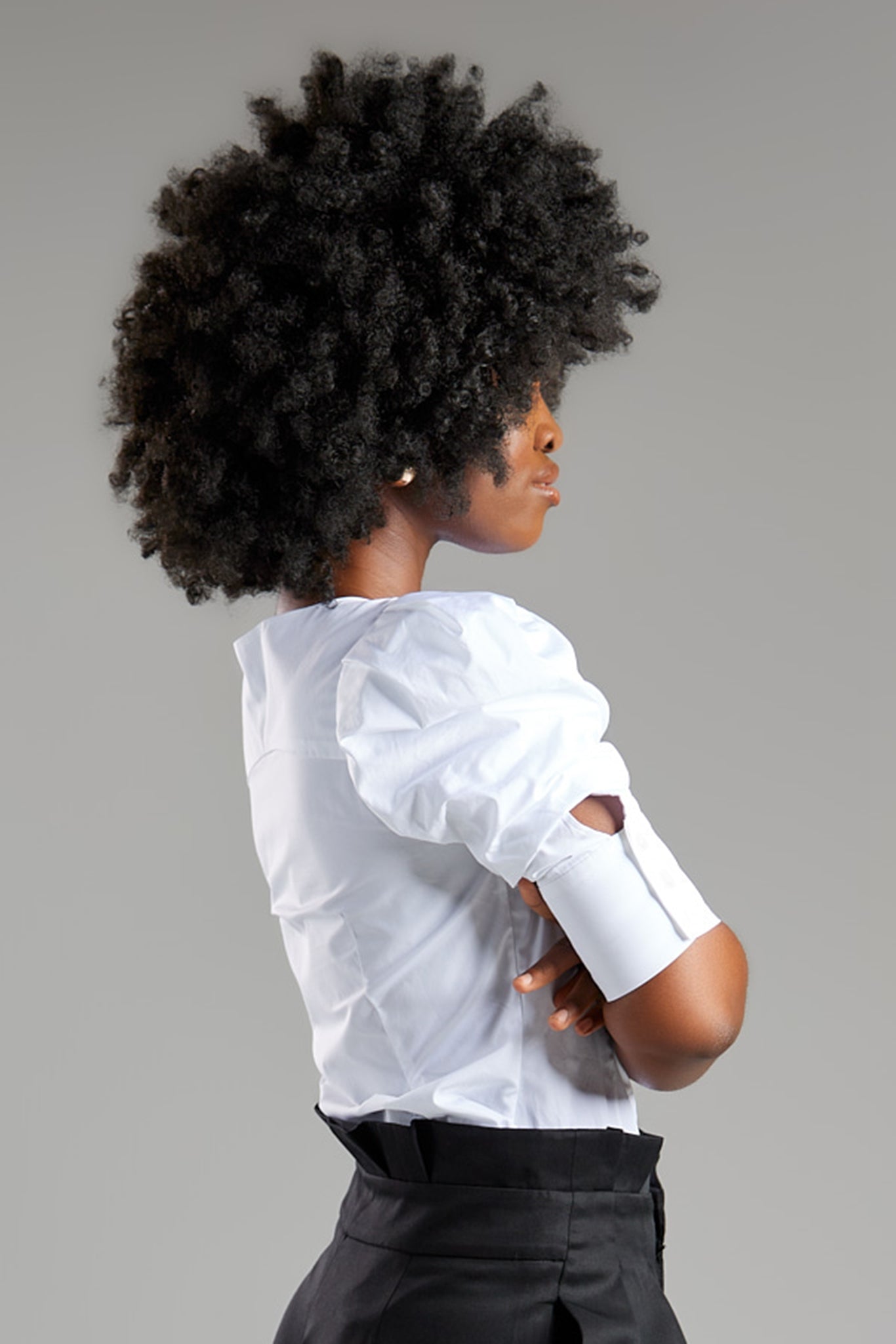 Seragyi's Martina Blouse in White, crafted from 100% eco-friendly cotton. Featuring an asymmetrical neckline and ruched sleeves, it's a versatile and elegant piece in Women's Clothing.