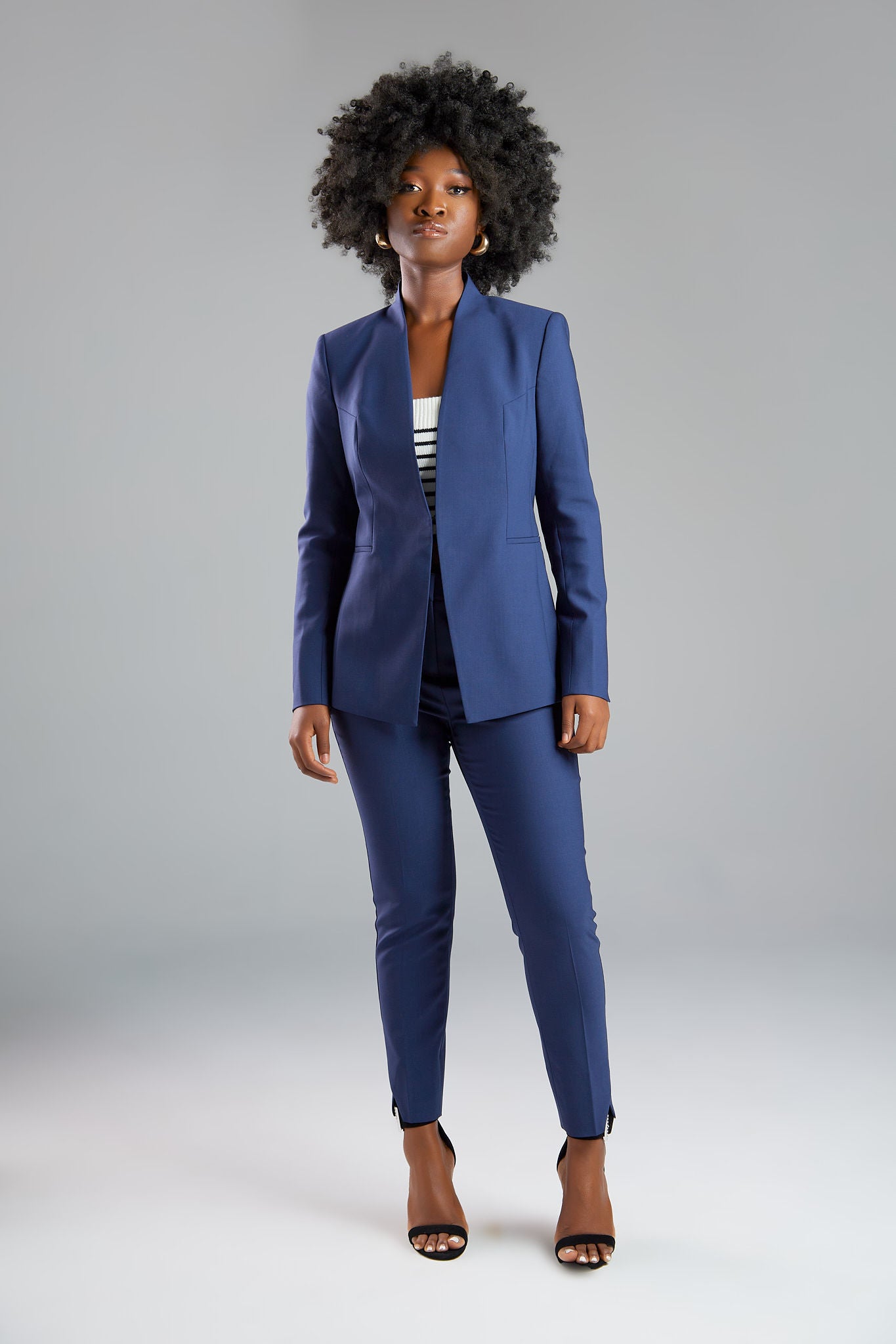 Seragyi's Nicole Blazer in Women's Suits, made from Italian Merino Wool. Features a cross-over collar and pyramid-cut sleeves, blending elegance and comfort in Women's Clothing.