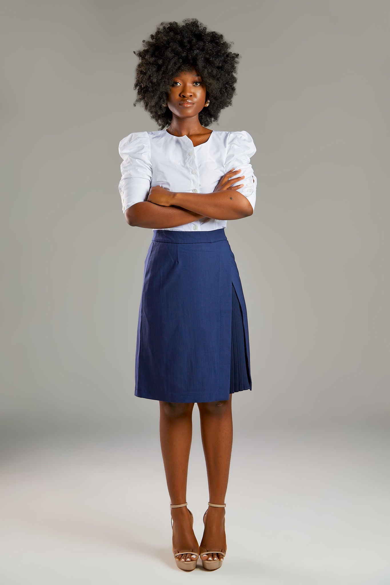 Seragyi's Mai Skirt, an elegant pleated design crafted from ethically sourced Italian Merino Wool and elastane. A blend of style, comfort, and sustainability in Women's Clothing, perfect for pairing with blouses or cowls. 