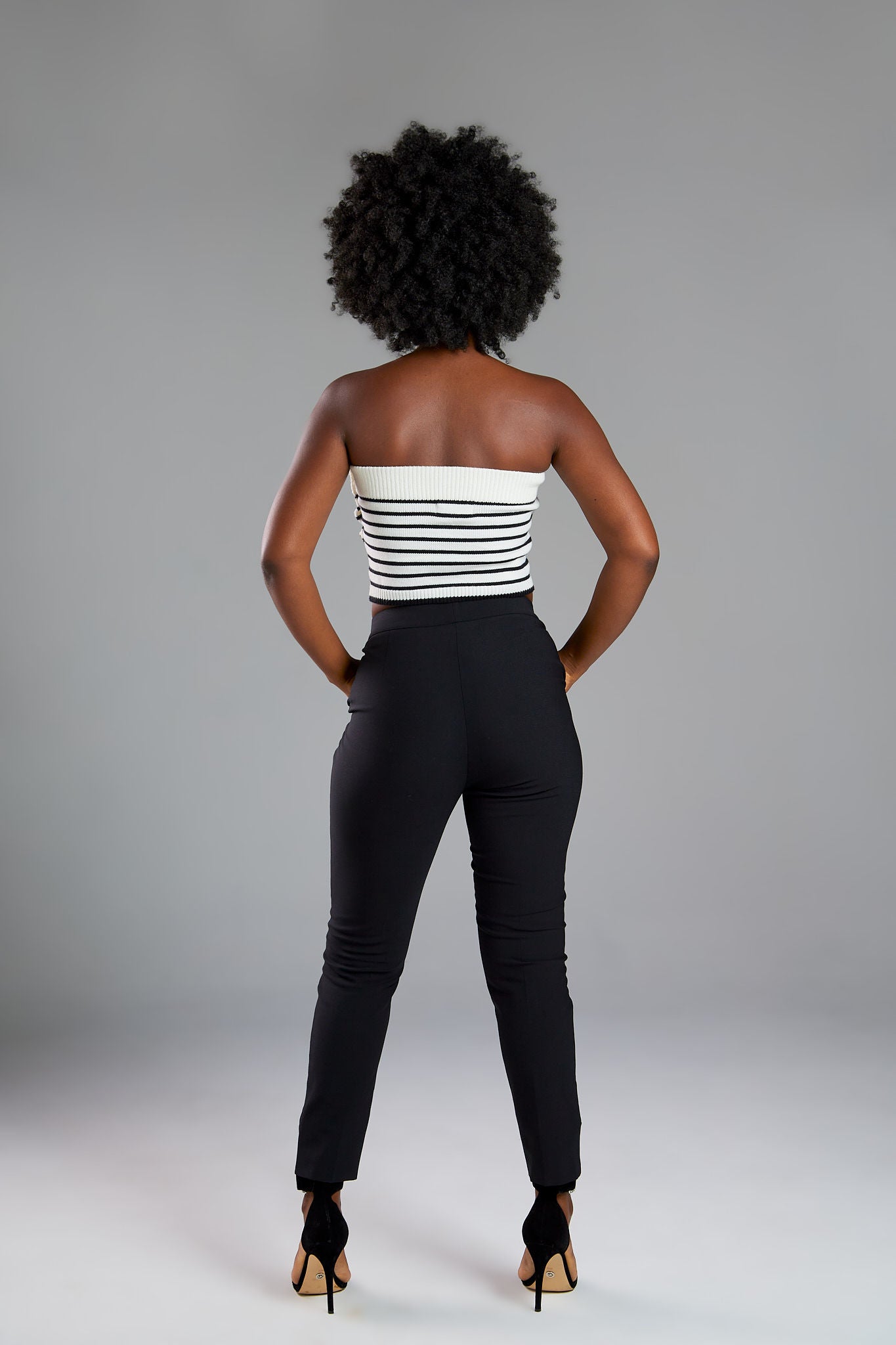 Women's pant suits with their distinctive ankle pyramid cut. Expertly crafted from Italian extra fine merino wool and elastane. Ideal for business meetings or casual wear.
