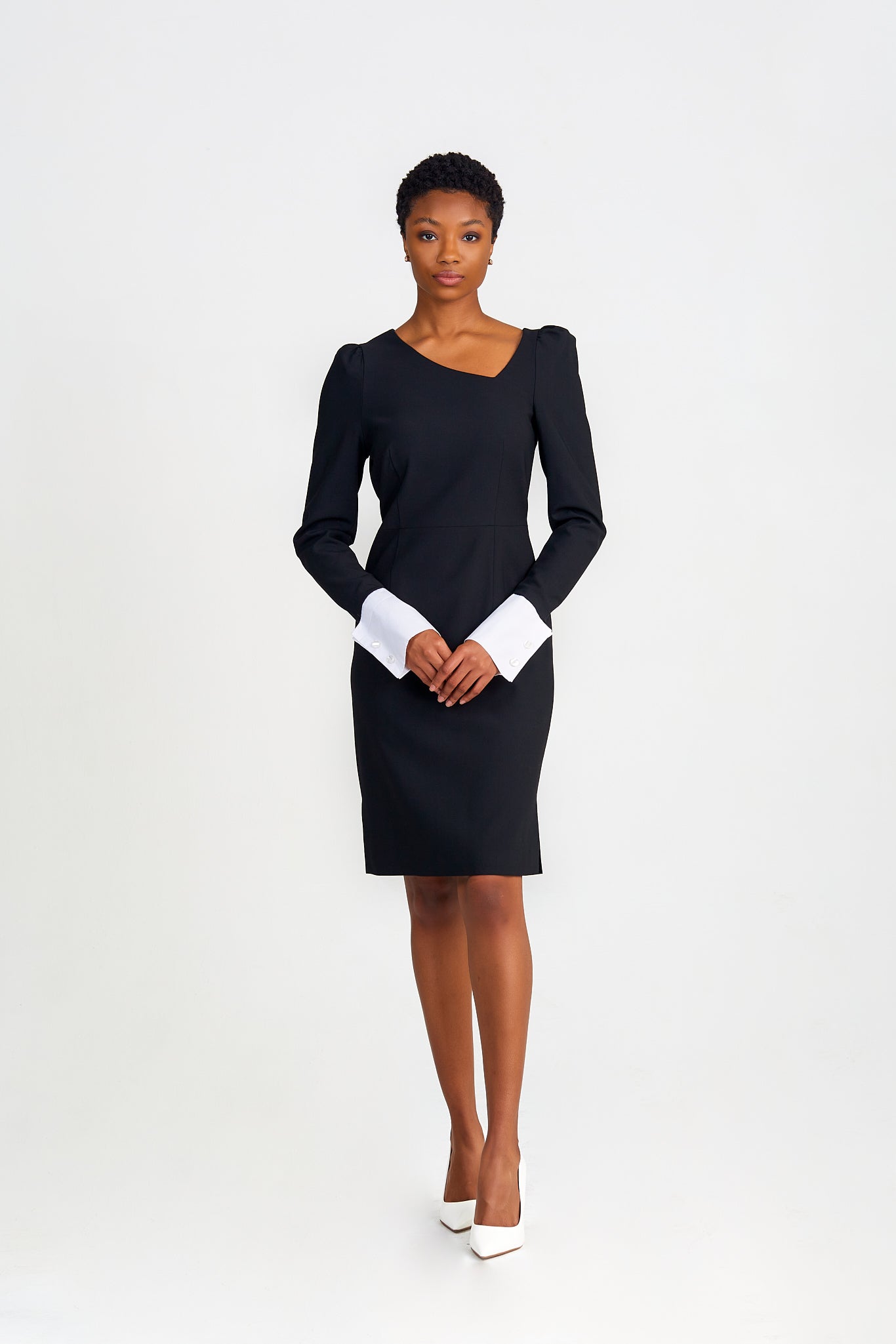 Perfect modern women's dress in Italian extra fine merino wool with asymmetric neckline, puff shoulders, and definitive cuff sleeve details