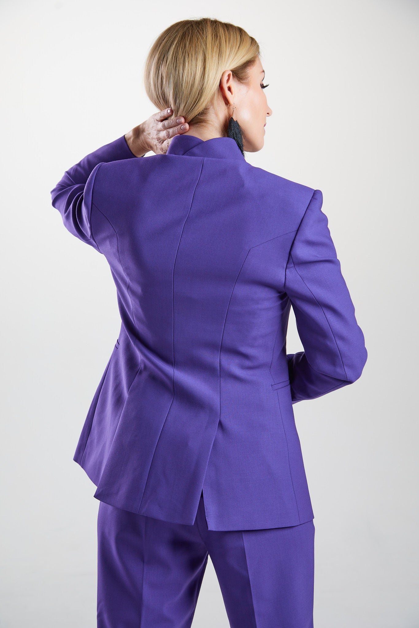 Seragyi's Nicole Blazer in Women's Suits, made from Italian Merino Wool. Features a cross-over collar and pyramid-cut sleeves, blending elegance and comfort in Women's Clothing.