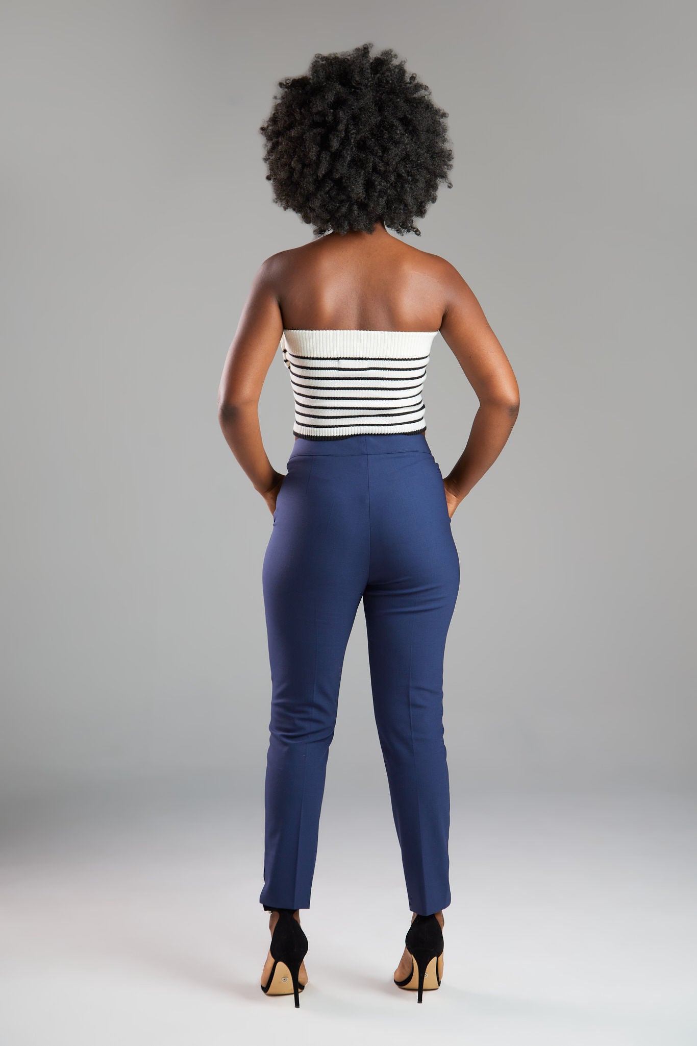 Women's pant suits with their distinctive ankle pyramid cut. Expertly crafted from Italian extra fine merino wool and elastane. Ideal for business meetings or casual wear.