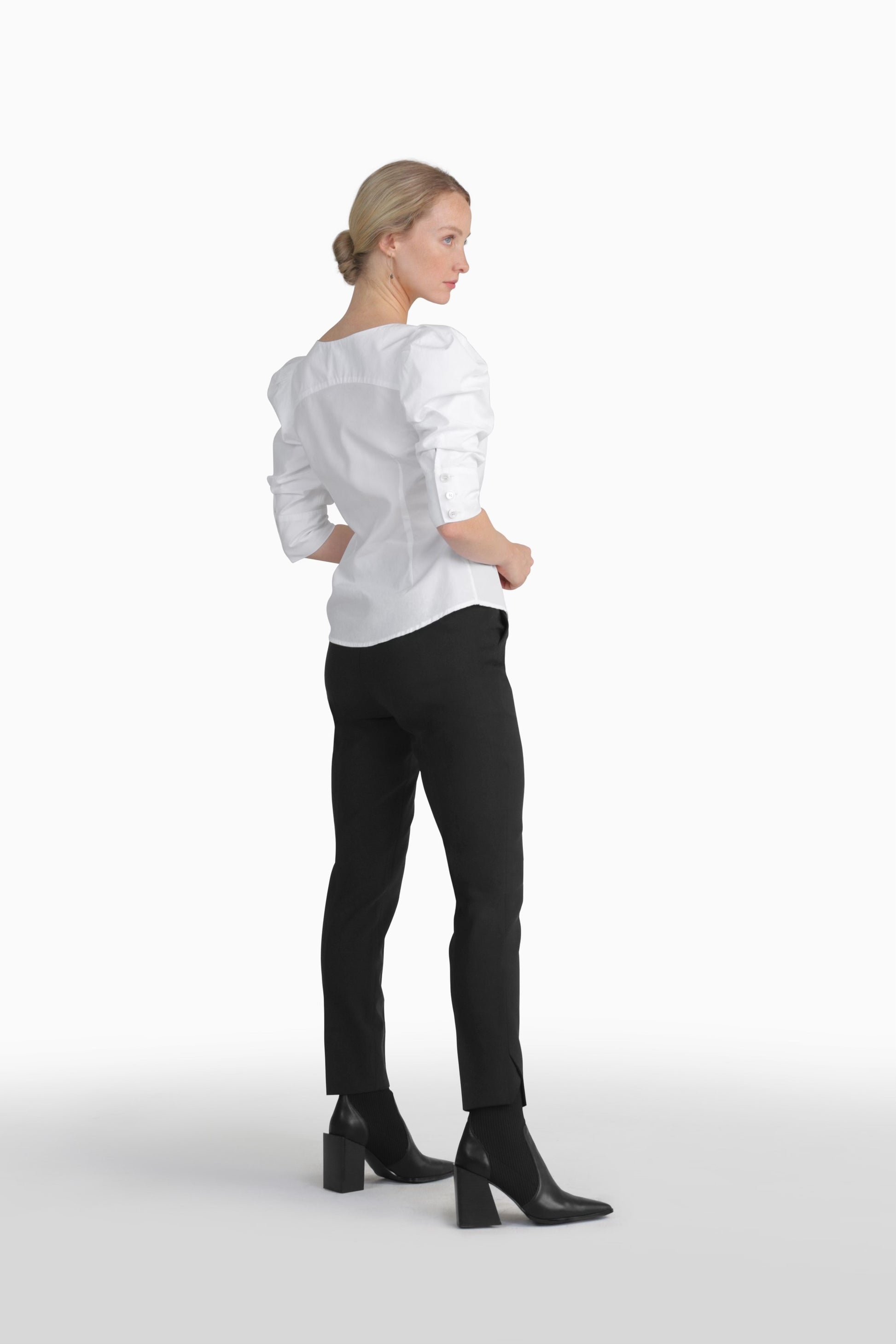 Seragyi's Martina Blouse in White, crafted from 100% eco-friendly cotton. Featuring an asymmetrical neckline and ruched sleeves, it's a versatile and elegant piece in Women's Clothing.